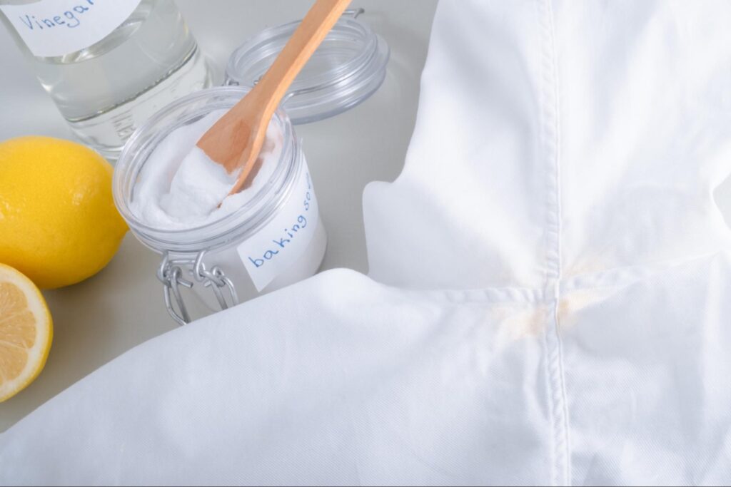 Scrubbing shirt underarm stain with baking soda paste