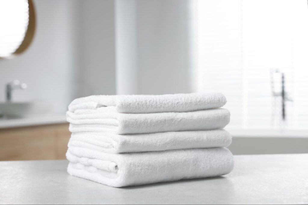 soft towels folded on table after washing with vinegar
