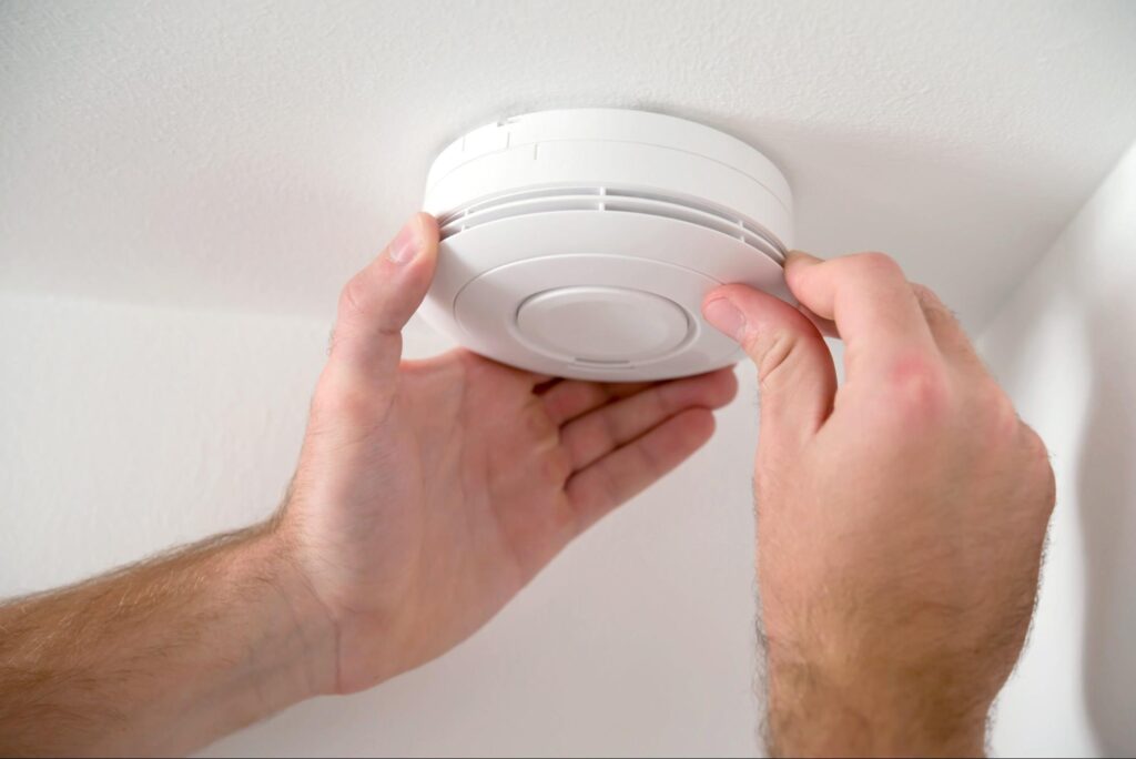 Home safety monitor for laundry room – carbon monoxide detector installed near dryer
