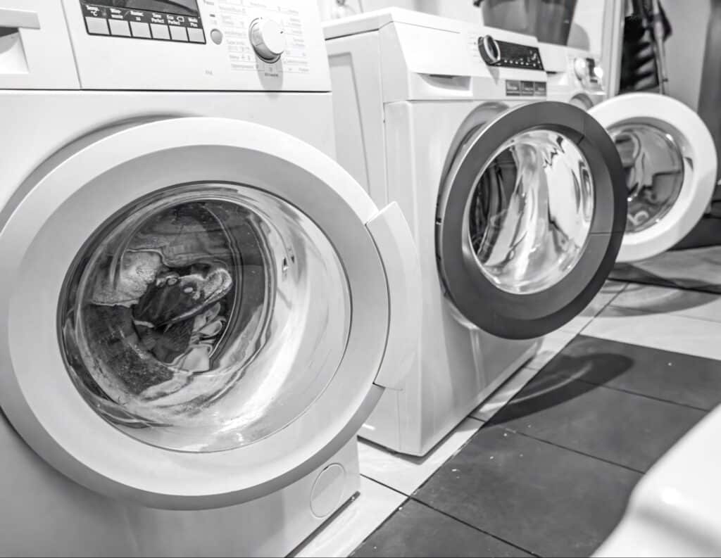 Laundry appliances in a home – a gas dryer and an electric dryer side by side