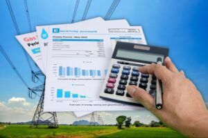 Stack of utility bills comparing electric vs gas dryer cost savings