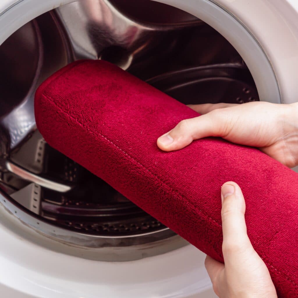 Washing a rubber-backed rug on a gentle cycle in a top-load washing machine