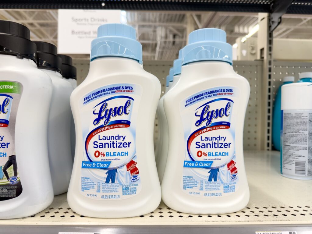 Several bottles of Lysol laundry sanitizer displayed on a store shelf