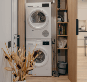 Stacked washer and dryer in a narrow laundry closet