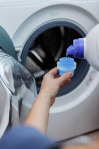 detergent-poured-into-front-load-washer