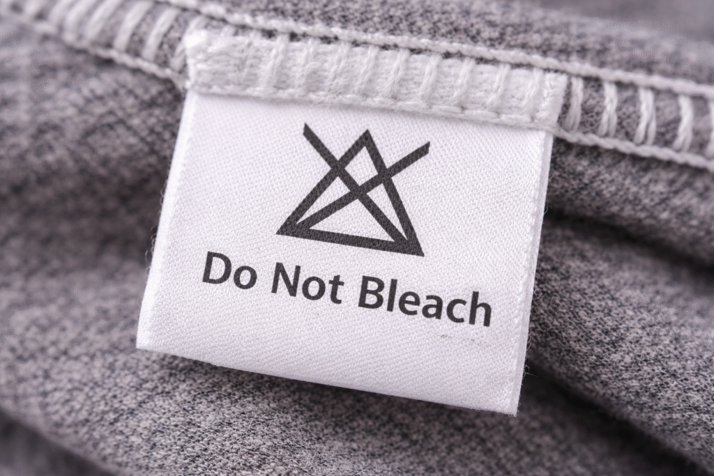 Clothing care label showing do not bleach symbol