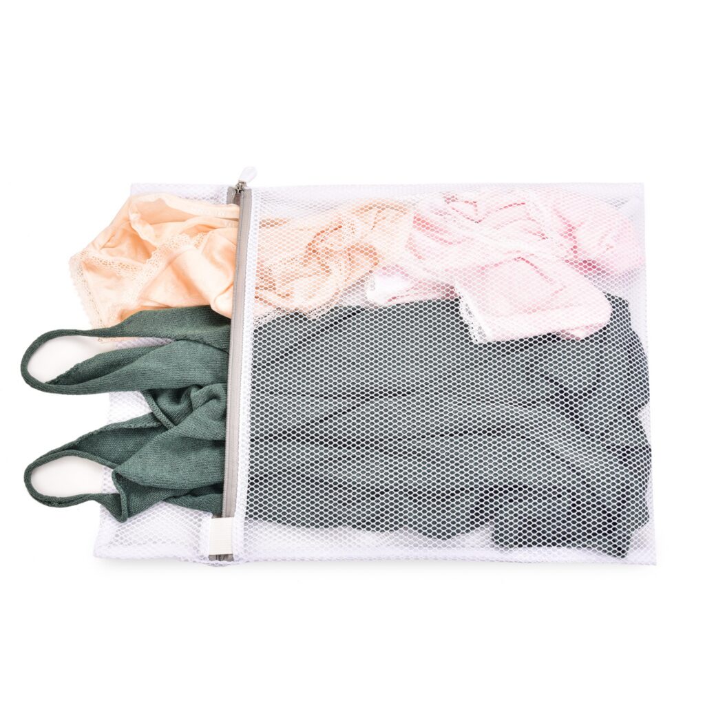 Delicate clothing placed inside a mesh laundry bag