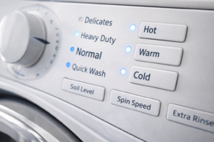 Washing machine control panel showing hot warm and cold settings