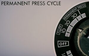 Washing machine dial set to permanent press cycle