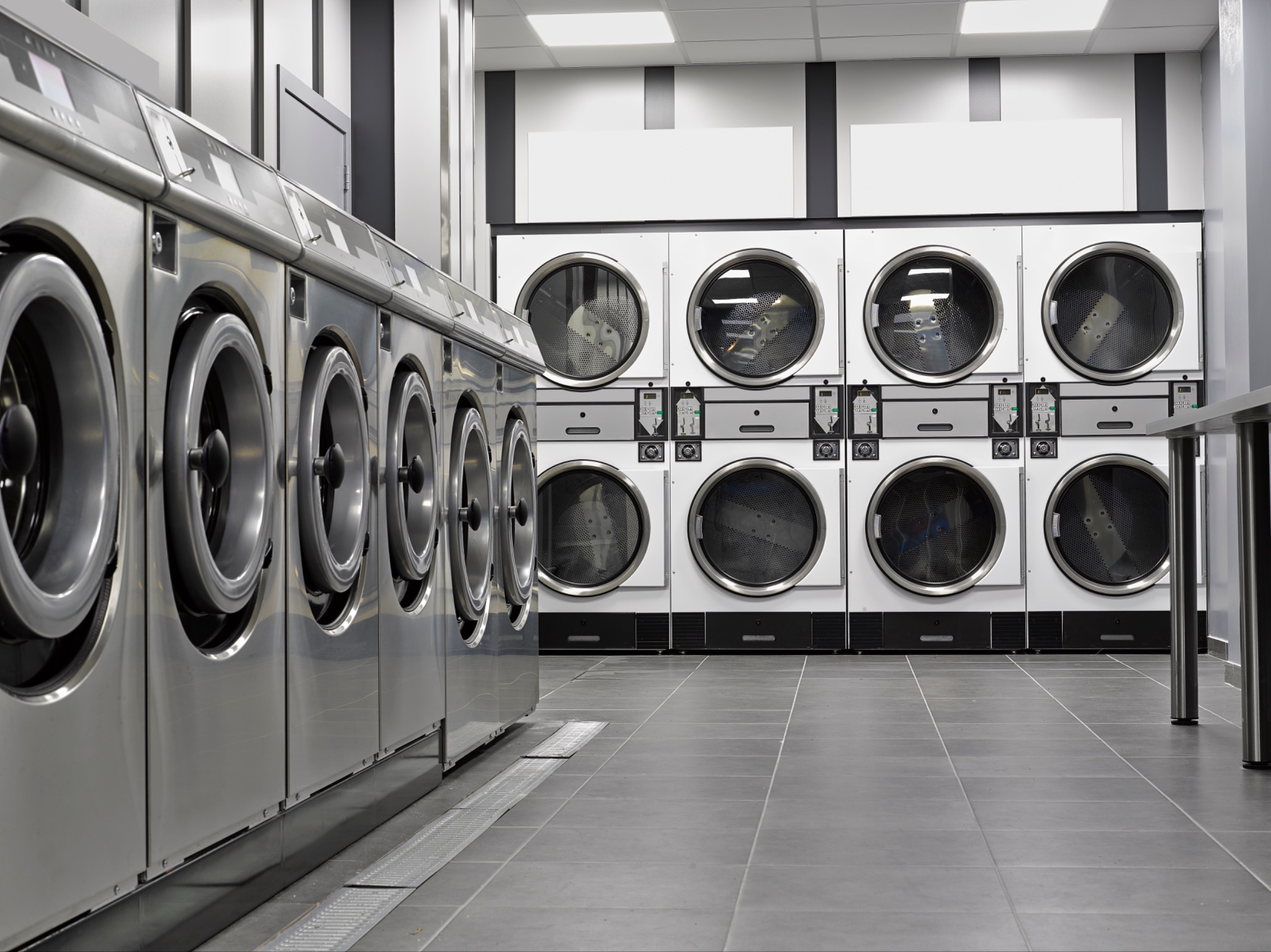 Row of washing machines in a laundromat