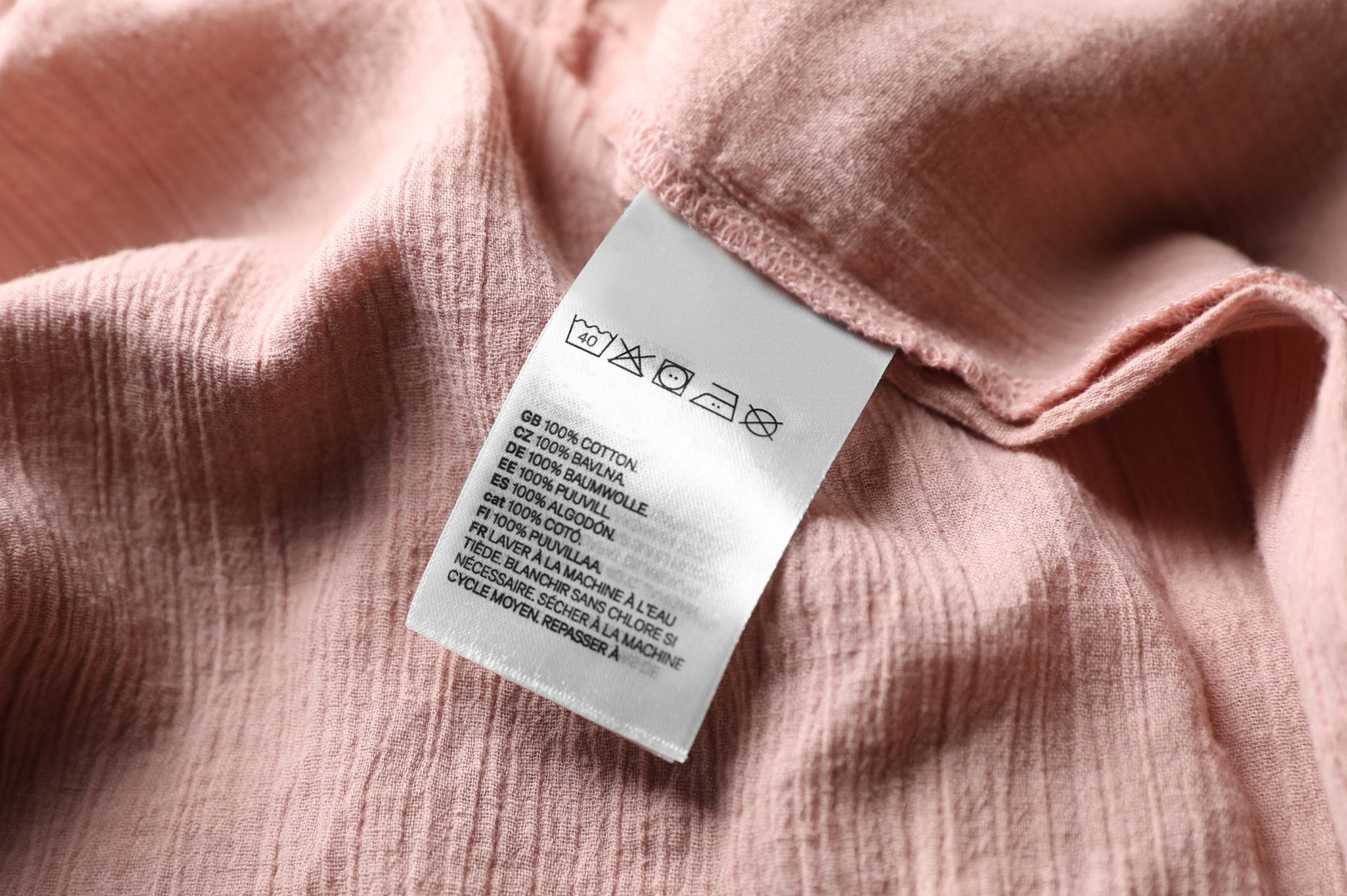 Pink fabric with care instruction label