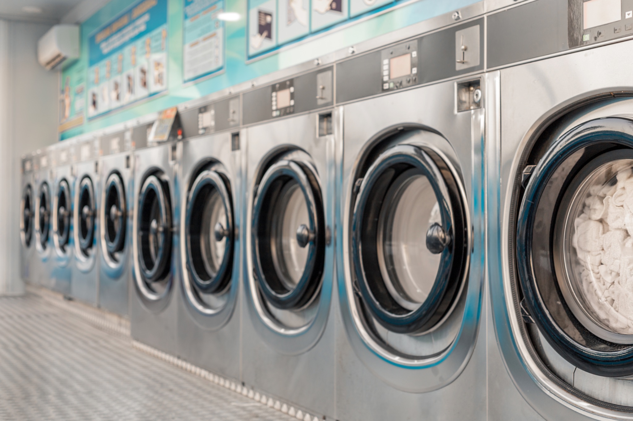 Industrial washing machines in a laundromat